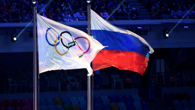 https://i.le360.ma/fr/sites/default/files/styles/asset_image_in_body/public/assets/images/2019/12/drapeaux-olympique-russe-flottent-ventde-ceremonie-cloture-jo-sotchi-23-fevrier-2014_0_729_485.jpg